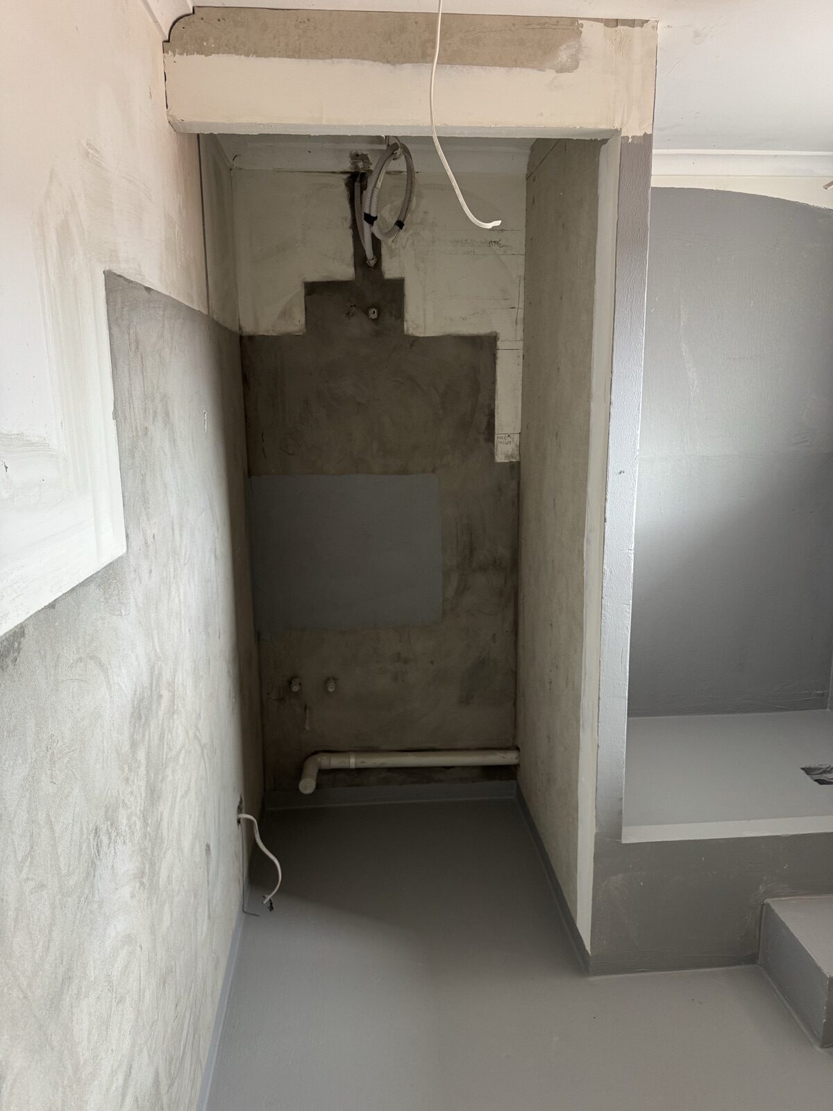 Bathroom recess with nib wall built to give the shower waste fall back to the main stack, Stanmore apartment renovation